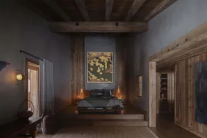 A minimalist bedroom with dark walls, wooden floors, and a botanical painting hanging above the bed.