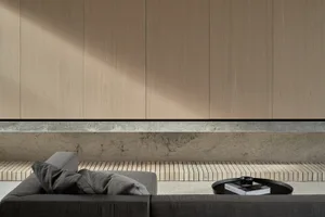 Minimalist living room featuring a concrete and wood interior design.