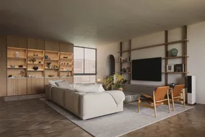 A modern living room with a grey sofa, wooden shelves, and a large window with blinds.