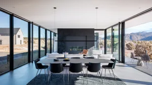 A modern interior design featuring concrete elements, with a clean and minimalist aesthetic.