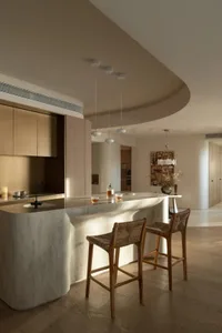 A modern living space featuring concrete, wood, and marble materials.