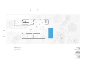 Floor plan of a modern residential building with various rooms and outdoor features.