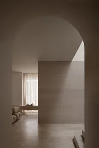 A minimalist residential interior with wood elements.
