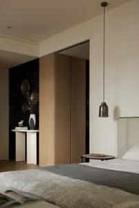 A modern bedroom with minimalist design featuring wood and concrete materials.