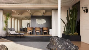 A modern commercial interior design featuring concrete, glass, leather, metal, and minimalist furniture.