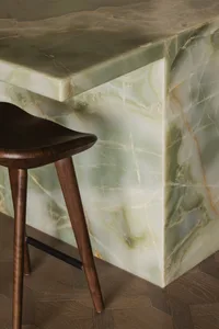 Modern kitchen with green marble cabinetry, sleek and contemporary design.
