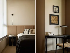 A modern minimalist bedroom featuring natural wood elements, with a bed and nightstand by a window with blinds.
