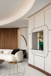 A modern minimalist living room with white furniture, wooden accents, and floral decor.