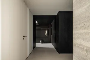 Concrete, steel, and leather interior with clothing realloc.