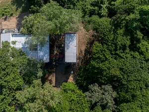 Minimalist residential architecture featuring a metal and concrete exterior.