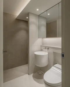 Bathroom with modern design features, concrete tile walls and floor, and minimalist aesthetic.