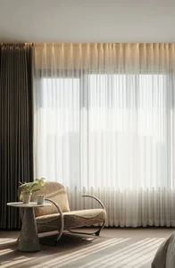A modern living room featuring white draperies and soft lighting.