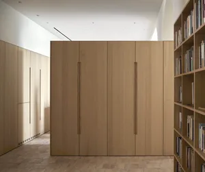 Modern minimalist storage unit made of wood with vertical handles.