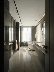 Contemporary bathroom featuring marble tiles and minimalist design elements.