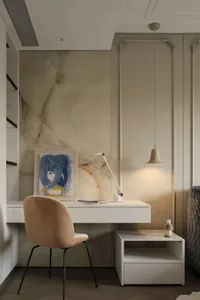 A minimalist bedroom with a modern desk featuring a marble surface.