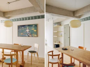 Modern minimalist dining room featuring wooden tables and chairs, concrete walls, and glass decorations.