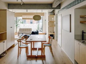 Modern residential interior featuring wooden furniture and concrete accents