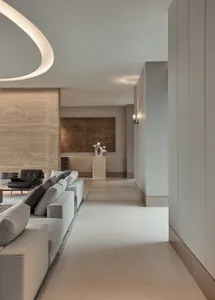 A modern living room with neutral-toned materials