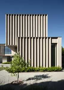 Modern architectural building featuring vertical wooden panels on the exterior.