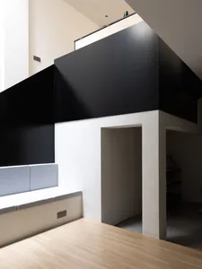 Modern living space featuring concrete walls and floor.