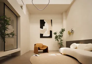 A modern living room with neutral-toned furniture and a minimalist design.