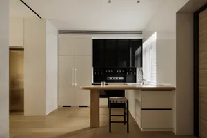 A modern kitchen with wooden elements and a minimalist design.