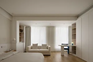 Simplified living space with a modern minimalist design, featuring neutral colors and a relaxing atmosphere.