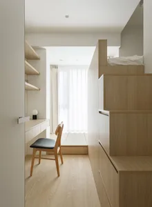 Modern minimalist bedroom with wood accents and a bunk bed.