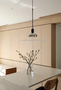 A minimalist interior design featuring wooden materials and sleek lines.
