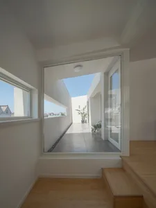 Contemporary, white staircase in a minimalist, interior design setting.