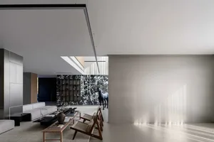 Contemporary living room with concrete and wood finishes, featuring clean lines and minimalistic design.