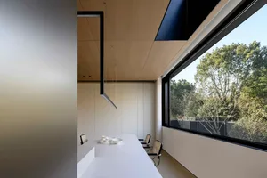 Indoor lighting and white concrete office space