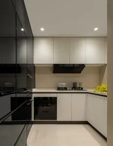 A modern kitchen featuring clean lines, white surfaces, and concrete elements.