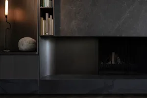 A modern living room featuring black metal elements and a minimalist design.