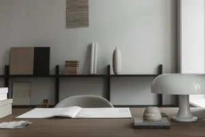 Modern workspace with minimalist furniture and wooden desk.