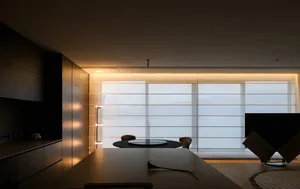 A contemporary kitchen with wooden cabinets and glass windows.