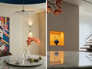 A modern dining room with a marble table and a round, white pendant light hanging above.