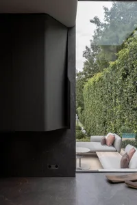Modern interior space featuring minimalist design with concrete accents.