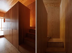 Modern wooden staircase with wooden walls and ceiling.