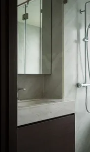 Minimalist bathroom featuring concrete materials and a modern design aesthetic.