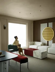 A modern living room featuring marble flooring and contemporary furniture.