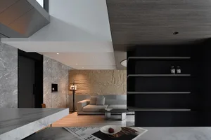 A modern living area with marble and concrete materials.