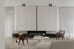 Contemporary living room with white and black marble accent wall and white and gray seating area