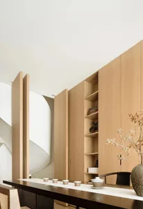Modern dining room with walnut cabinets and minimalist design.