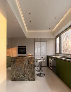 A modern kitchen interior featuring a concrete countertop with a metallic base.