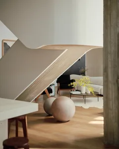 Modern interior design featuring a living room with wooden furniture and concrete floor.