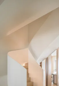 Modern minimalist staircase made of concrete, featuring clean lines and an elegant design.