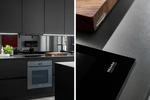 Modern minimalist kitchen with dark cabinets, stainless steel appliances, and a sleek design.