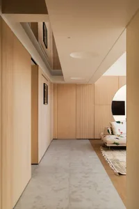 Modern residential interior featuring minimalist design with wood, concrete, and glass materials.