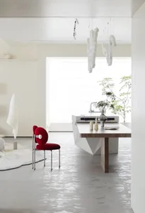 Modern kitchen interior with marble countertop and white appliances.